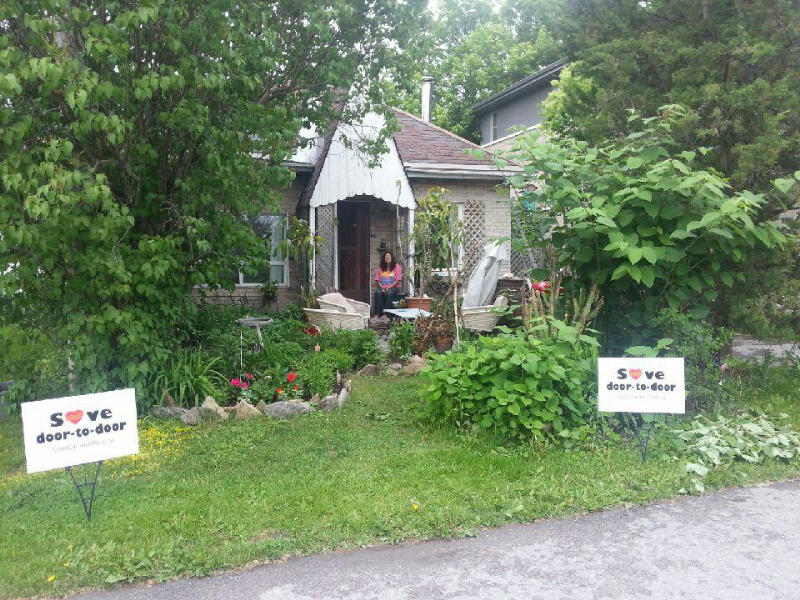 Lynda Kitchikeesic in front of her home. Lynda Kitchikeesic in front of her home.