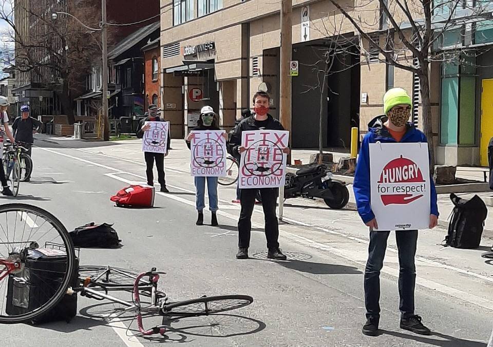 Photo 2: Foodora Couriers and CUPW stage a safe, physically distanced protest at Foodora Canada’s headquarters.