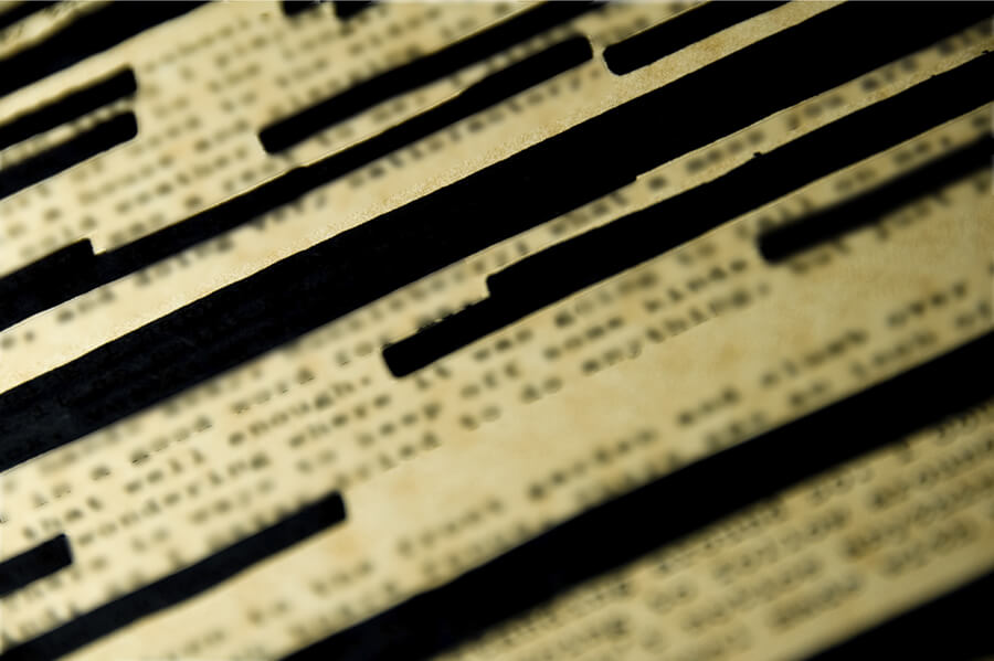Image of a page with redacted text